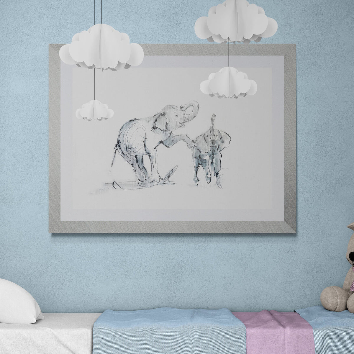 Elephant family nursery wall art print by Wendy Laverick displayed framed in a soft pastel children's bedroom interior