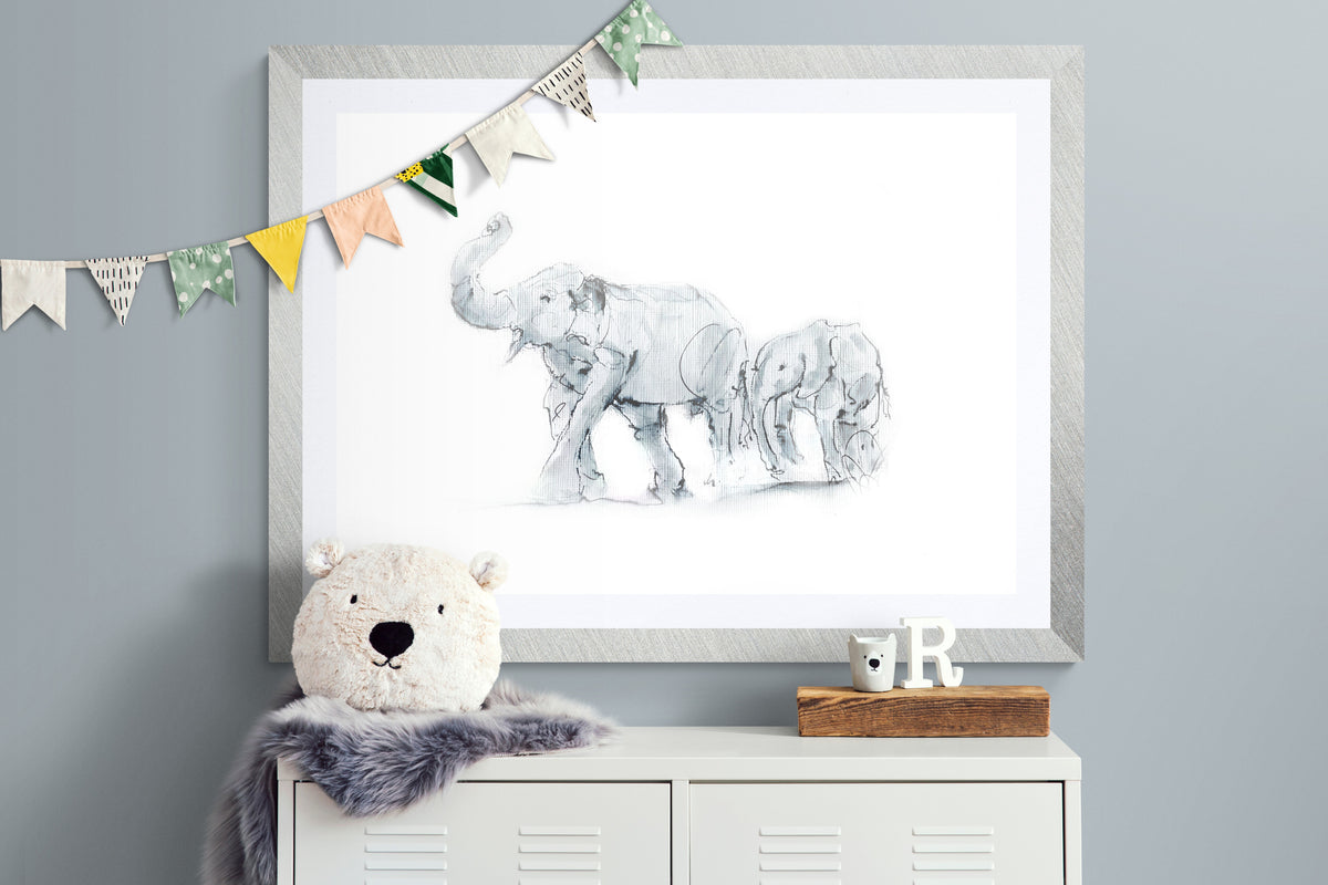 Framed elephant mother and calf nursery wildlife artwork displayed in children’s bedroom interior